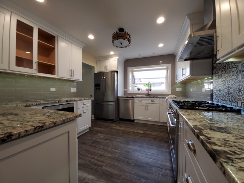Backsplash and lighting detail in custom kitchen